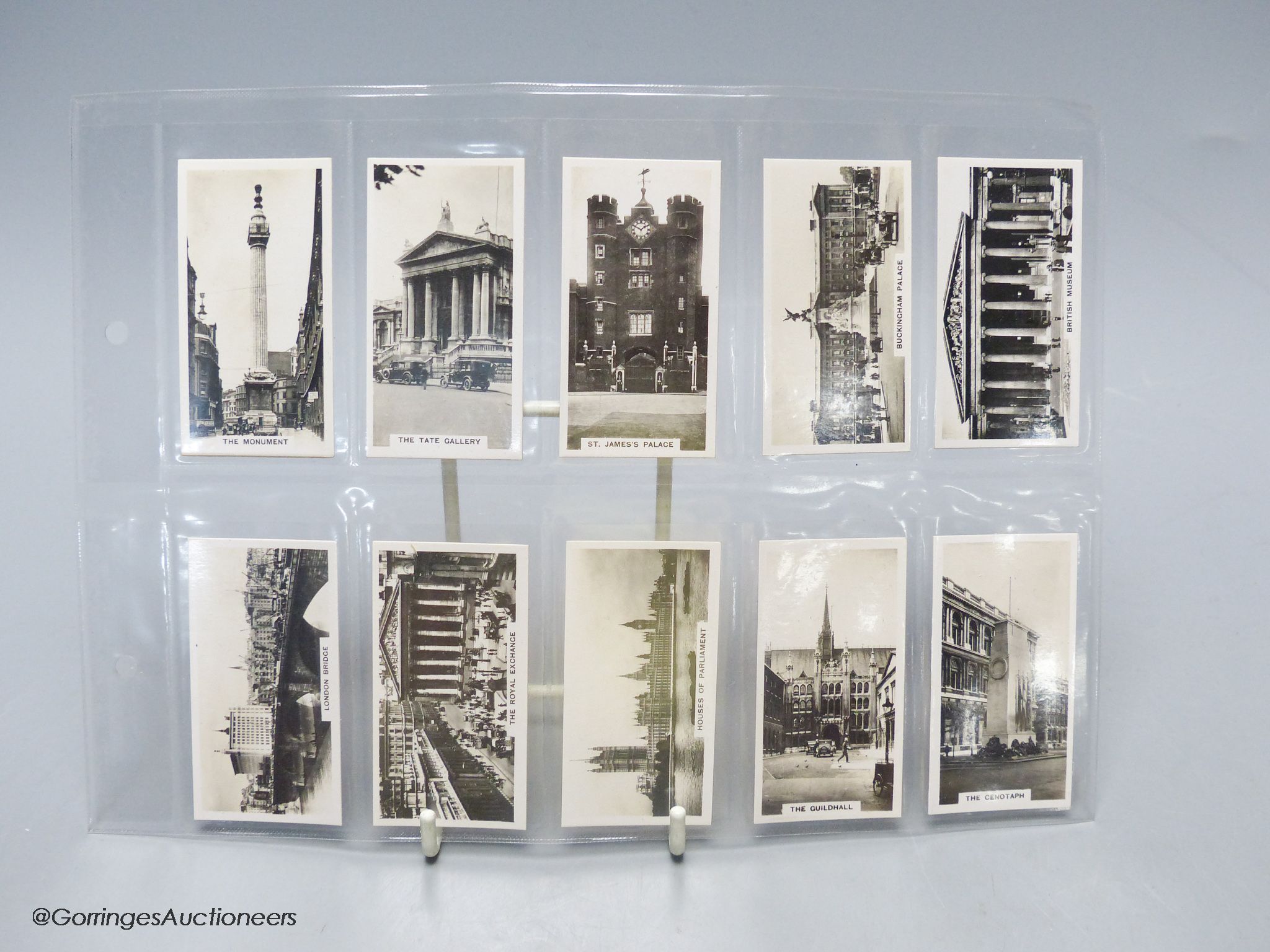 Smoking items including a Japanese camera lighter and cigarette cards